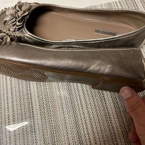 Metallic gold flats.